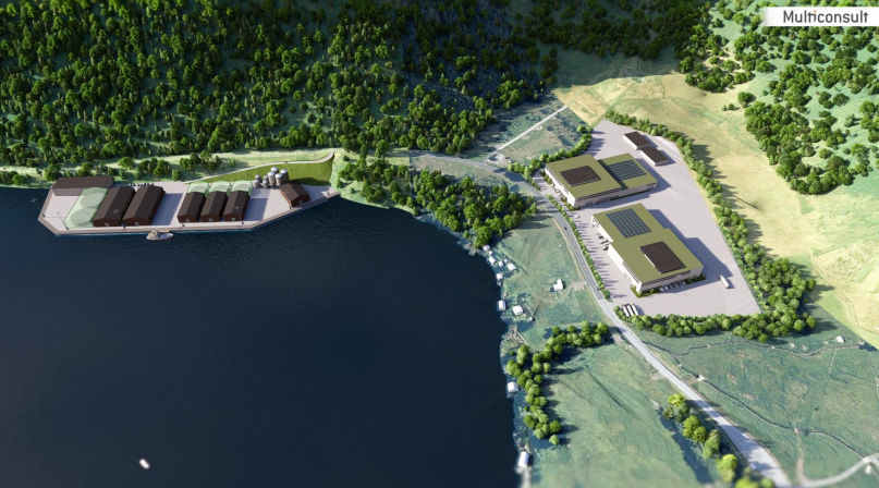 Bygninger og kai ved sjø